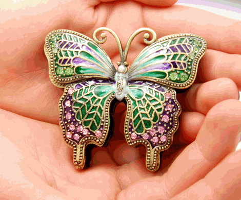 Green Butterfly w/ pink crystals Cremation Keepsake shown in hands